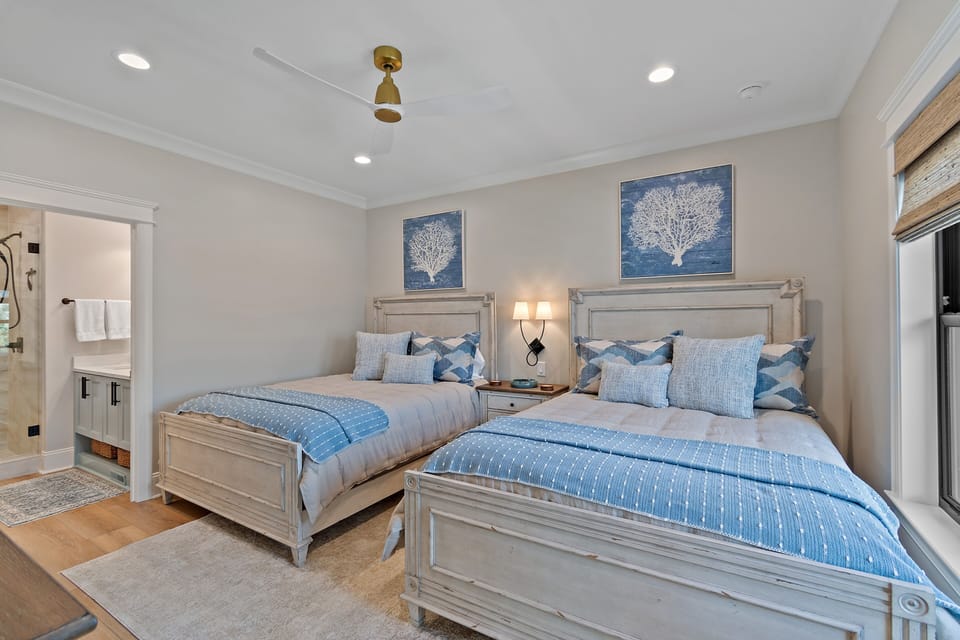 Double Queen Bedroom on second floor with tv, ceiling van and ensuite bath. 