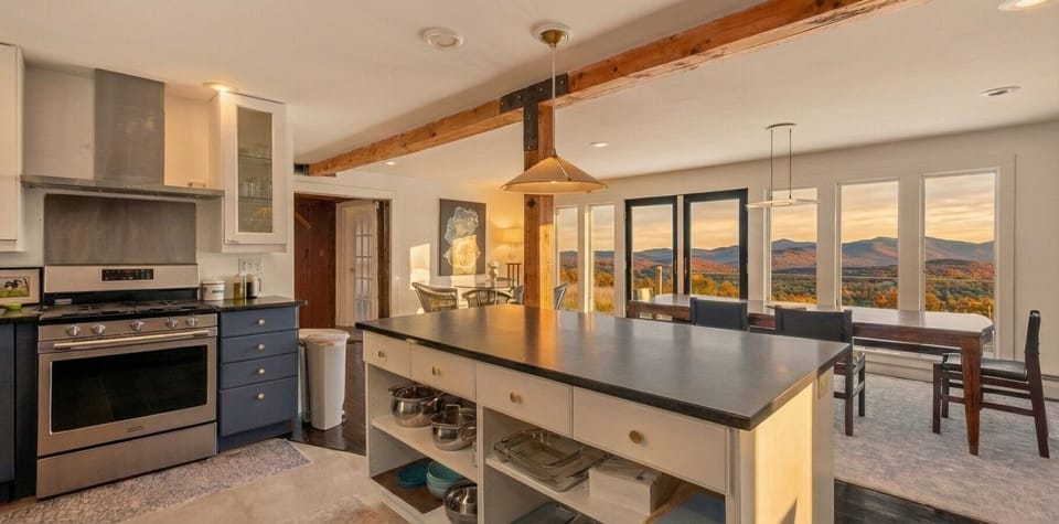 Modern kitchen with mountain view, ready for your culinary creations!