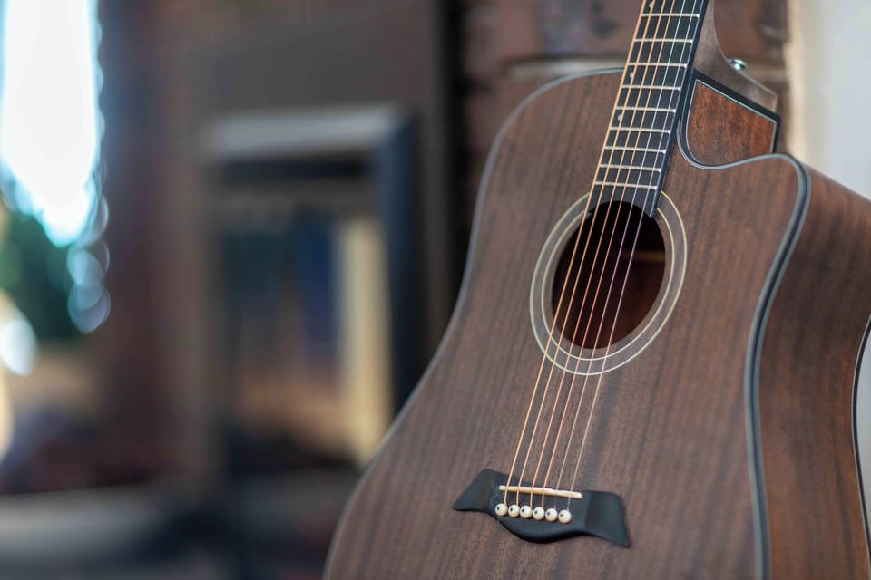 Acoustic guitar available for guests to enjoy.