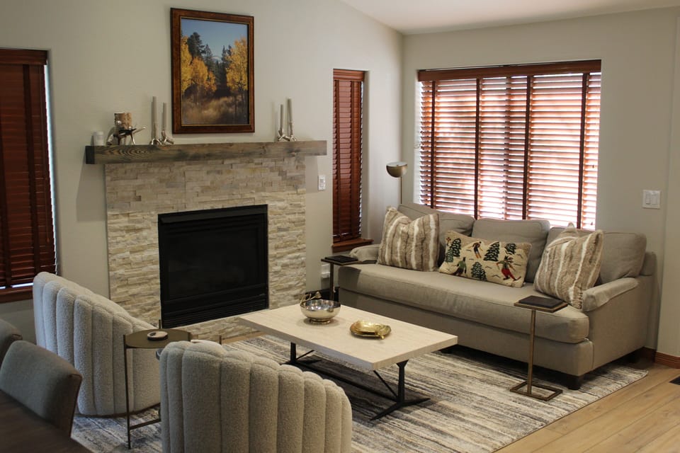 Living Room - Spacious living room designed for group gatherings. Includes a gas fireplace with vaulted ceilings.