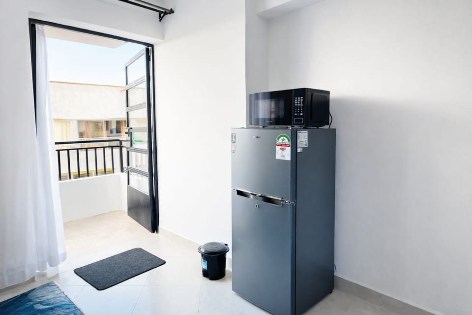 Double door fridge and microwave.