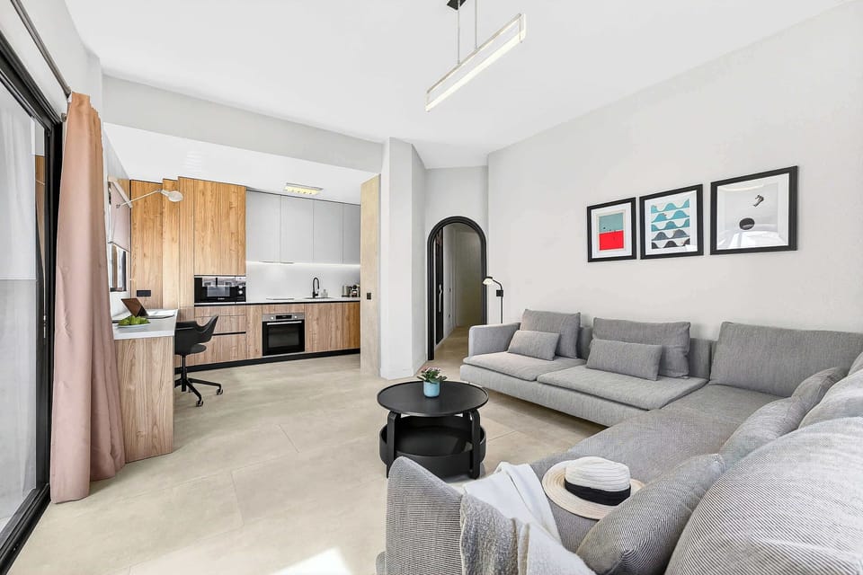 Sitting & Sleeping in a Spacious Living Area with Ocean View, AC, Multimedia TV & Sonos Sound System, Dedicated Working Space & Direct Exit to the Private Roof-Top Terrace