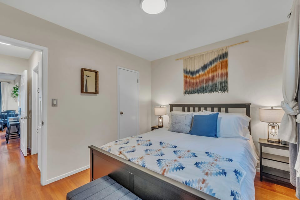 Queen room includes a closet with shelves for storage and a suitcase rack.