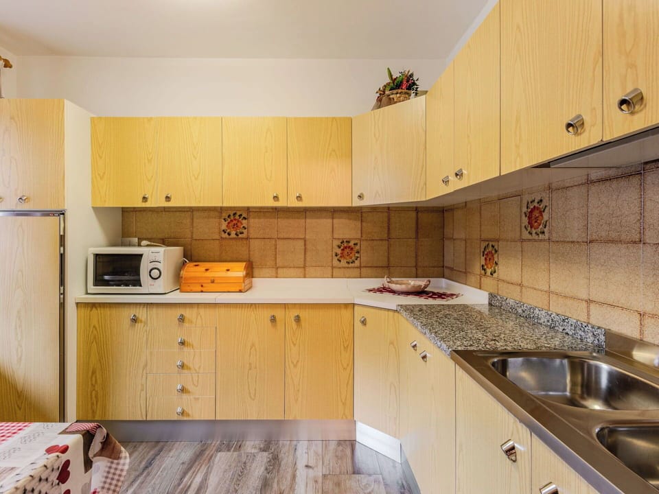 Kitchen, Interior Design, Flooring, Kitchen Appliance, Wood, Countertop, Major Appliance, Cabinetry, Floor, Room