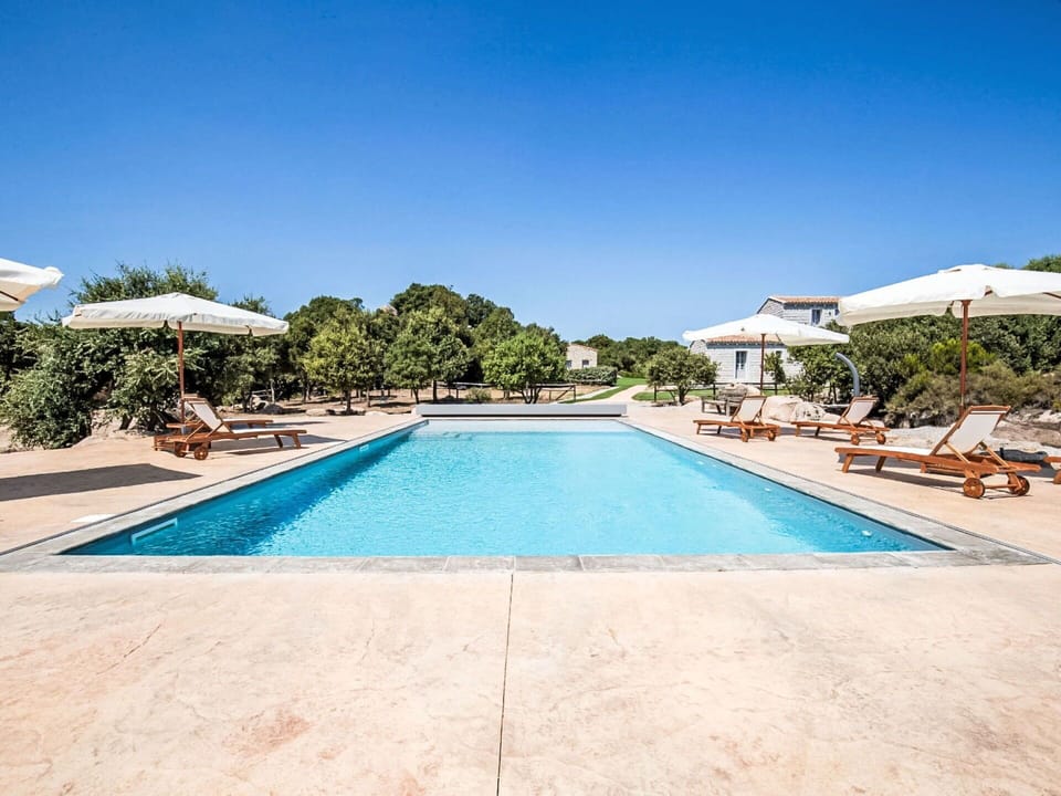 Blue, Shade, Resort, Outdoor Furniture, Leisure, Swimming Pool, Umbrella, Estate, Landscaping, Eco Hotel