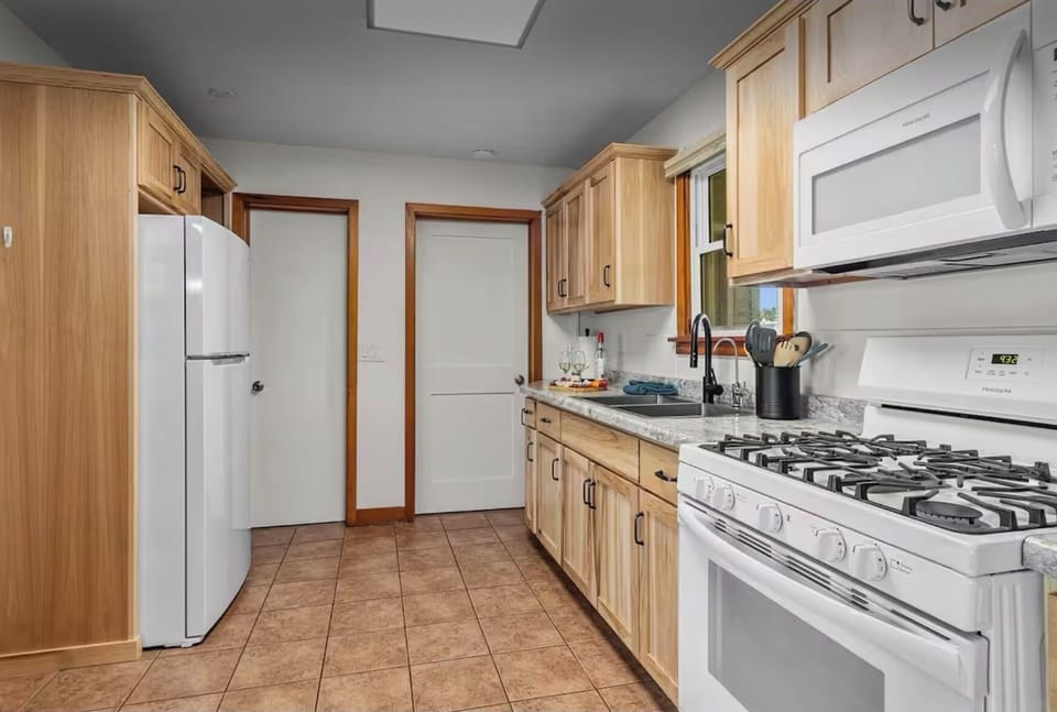 Full kitchen stocked with everything needed for cooking.