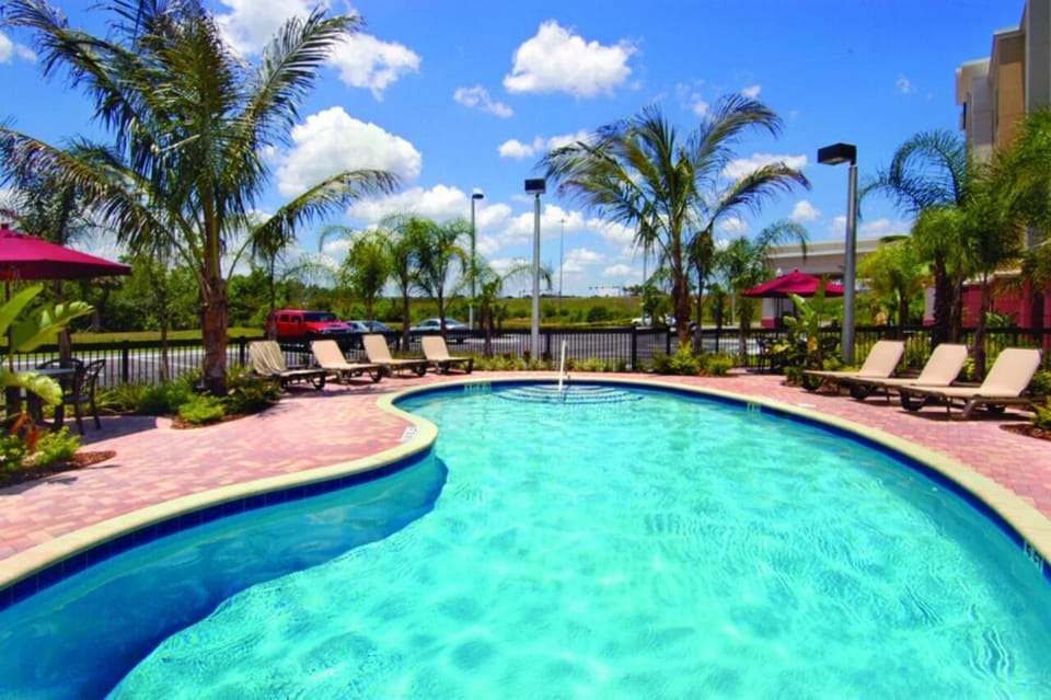 Soak up sunshine beside the refreshing pool and loungers.