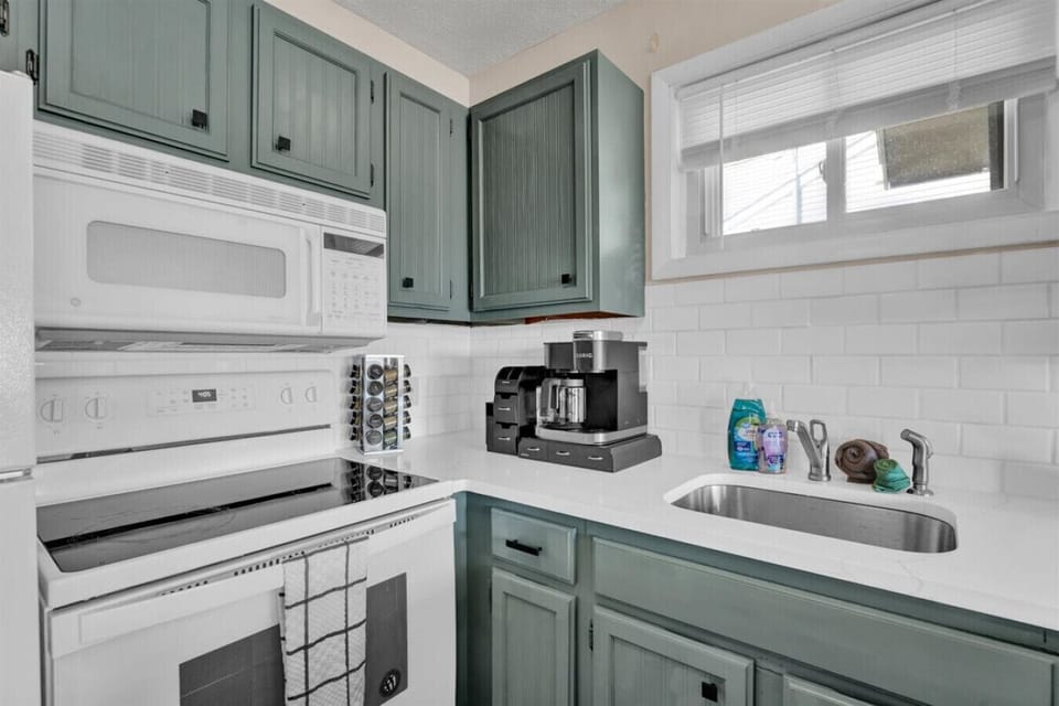 Our bright kitchen has everything you need—stove, oven, fridge, and more—ready for all your cooking adventures.