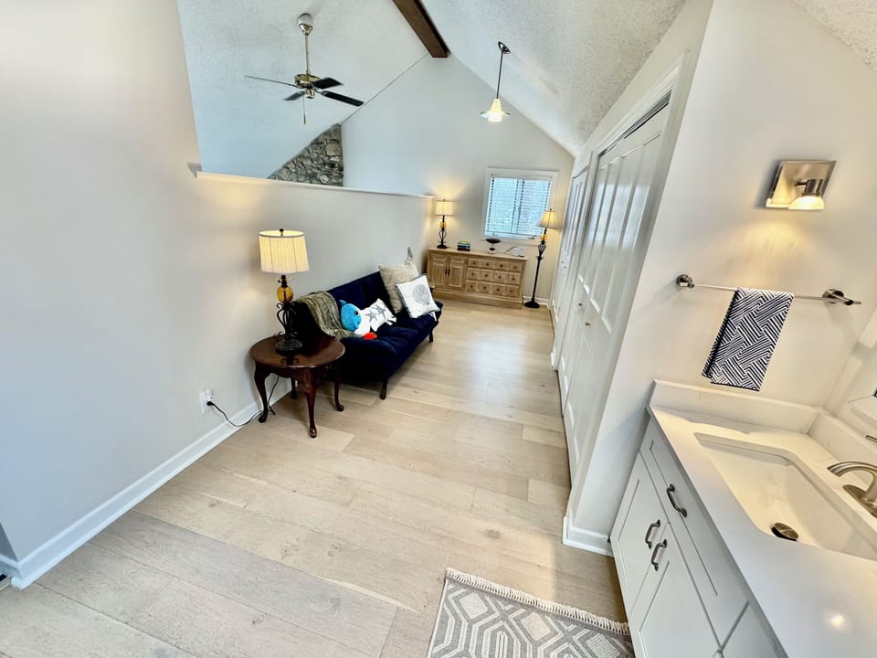 Separate sitting area within master bedroom #1: 2 sinks and 1 sofa bed