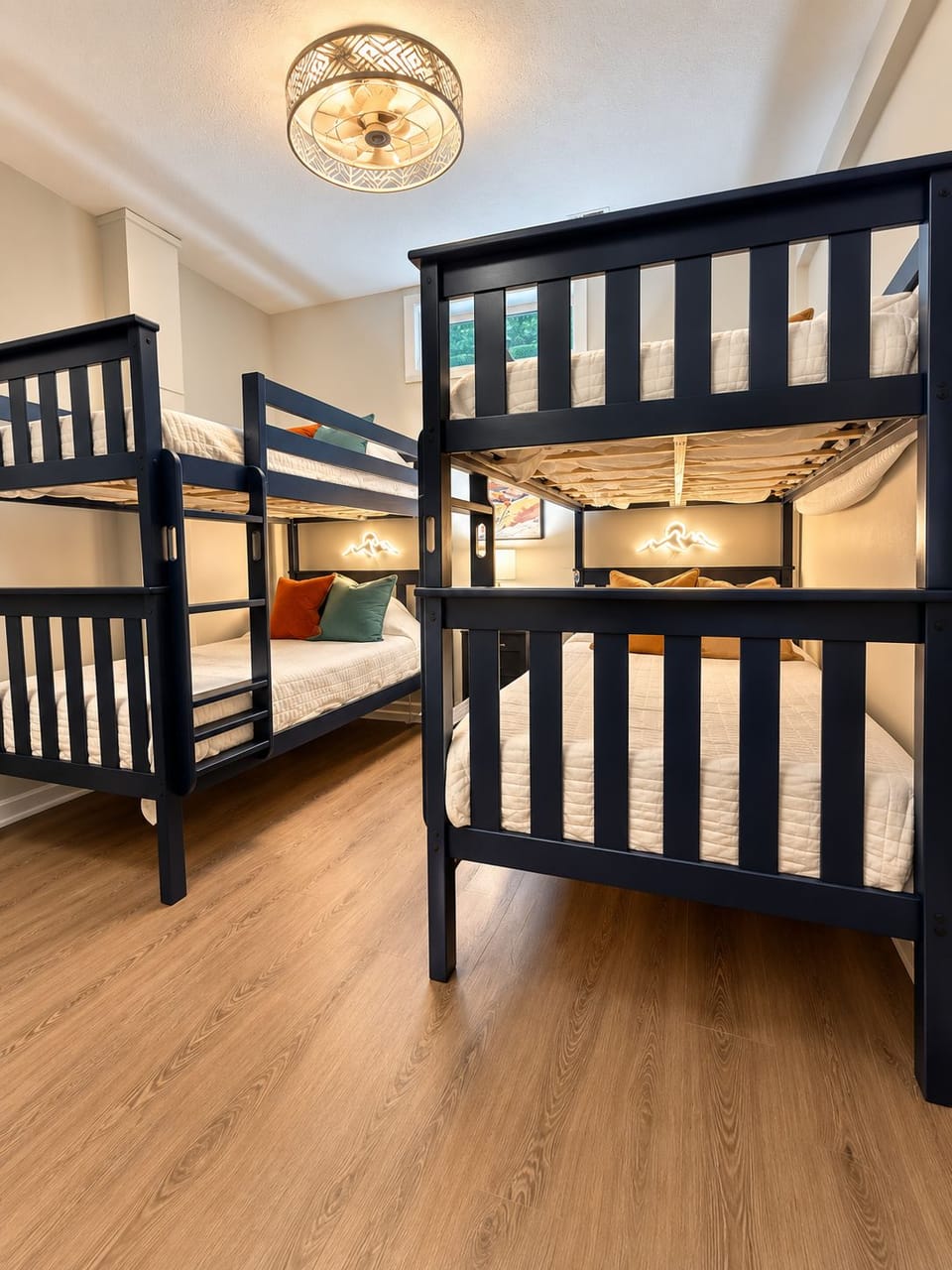 Stylish bunk room with cozy lighting—perfect for families or groups