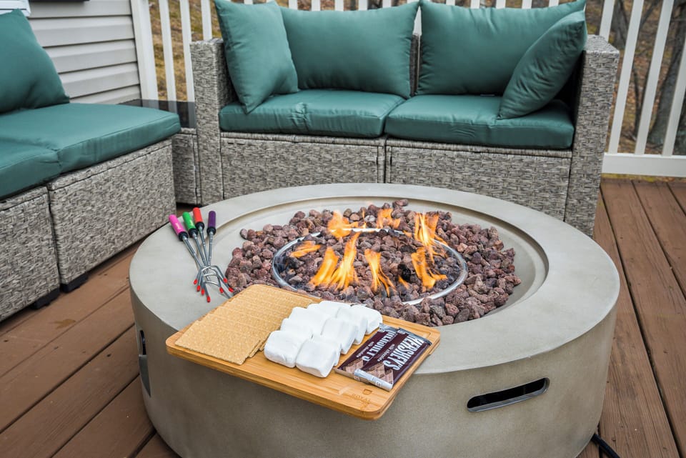 Front Porch Deck with sofa, fire pit, and mountain views