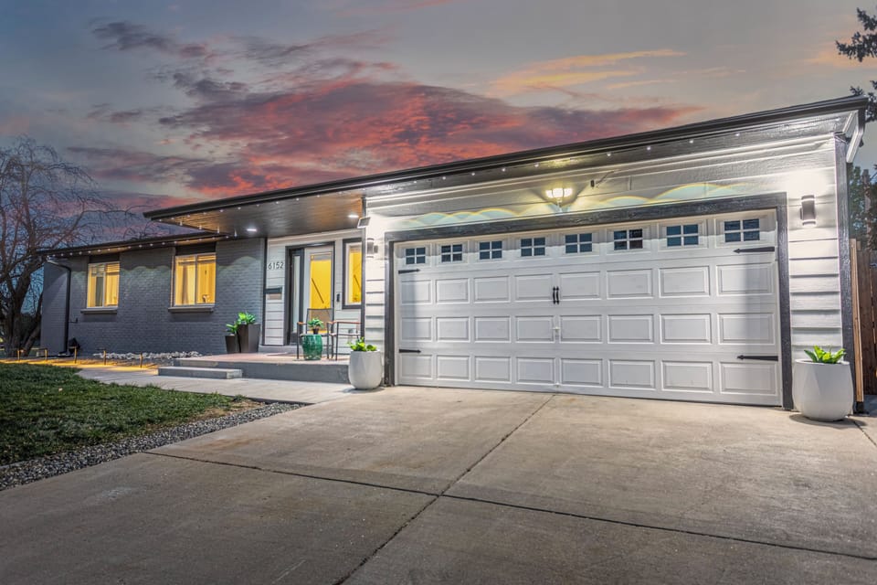Front exterior of the home with private yard and driveway