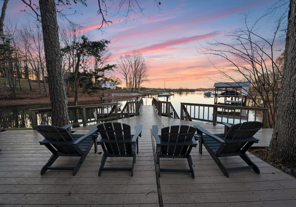 Sunset view from the private dock with Adirondack seating.