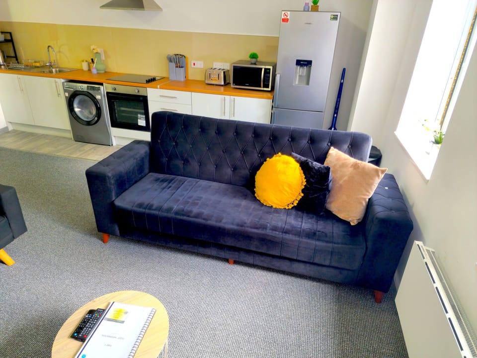 Sunny open-plan lounge + full kitchen, washer, and large fridge