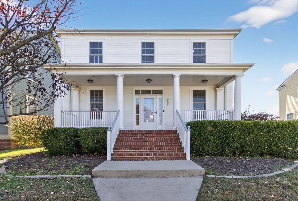Welcome! This charming two-story home greets you with classic Southern charm and a picture-perfect porch. The bright, clean curb appeal sets the tone for a relaxing stay. 