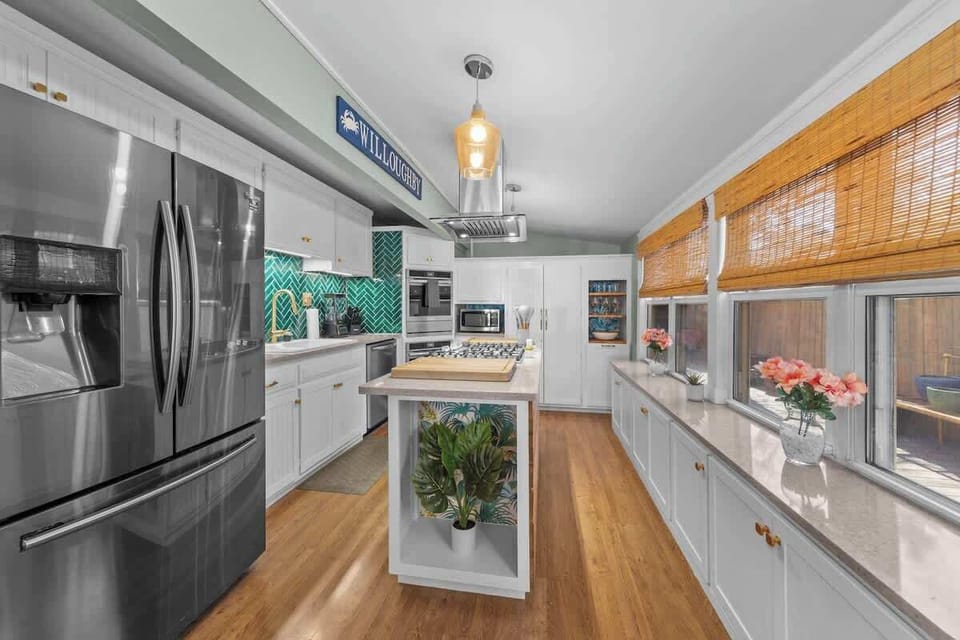 A modern kitchen fully equipped with stainless steel appliances and ample counter space. Ideal for preparing delicious home-cooked meals.