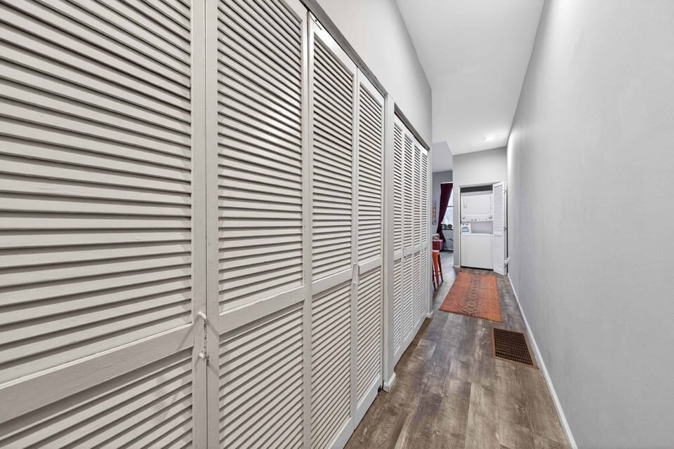 3. Embrace the charm of this inviting hallway! 🌼 With its warm wooden shutters and a door that beckons, it’s the perfect spot to start your next adventure. What memories will you create here? 