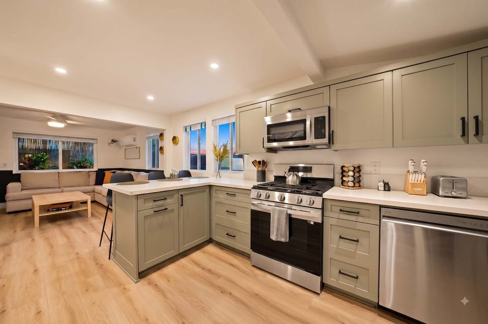 Fully equipped modern kitchen with stainless steel appliances