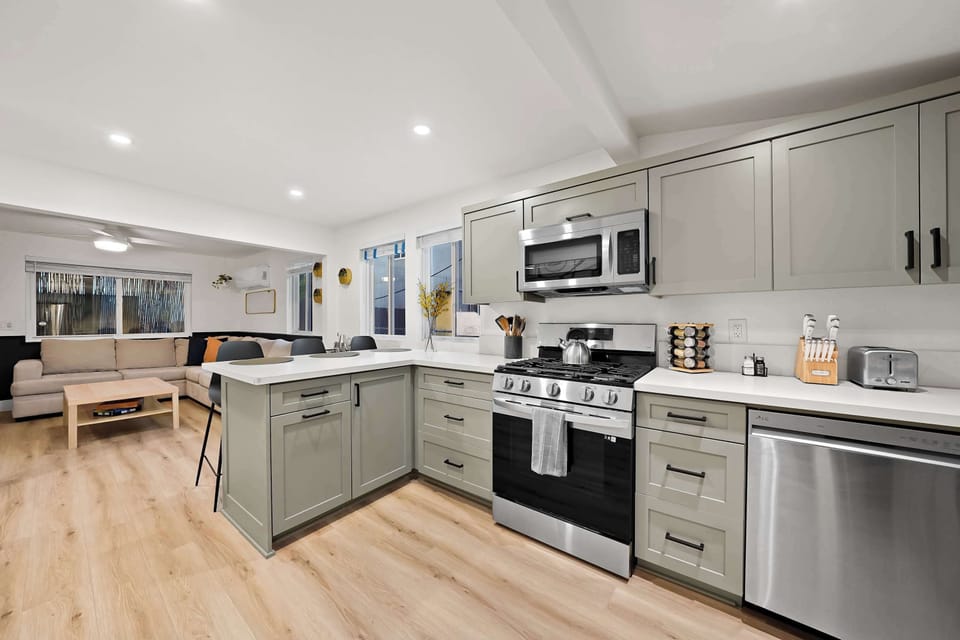 Fully equipped modern kitchen with stainless steel appliances