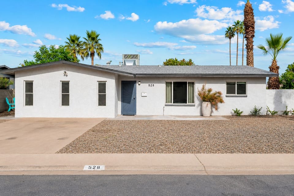 Single level home with desert landscape