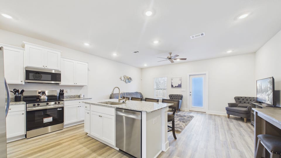 Walk into your kitchen and living areas with bright modern furnishings and appliances