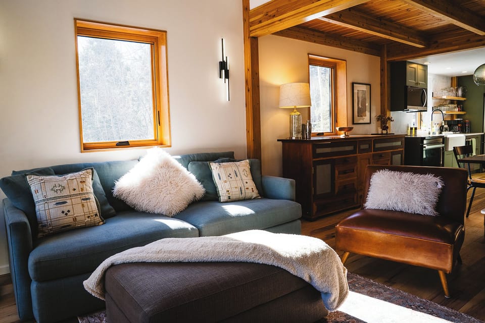 Cozy livingroom in an open concept second level with deck