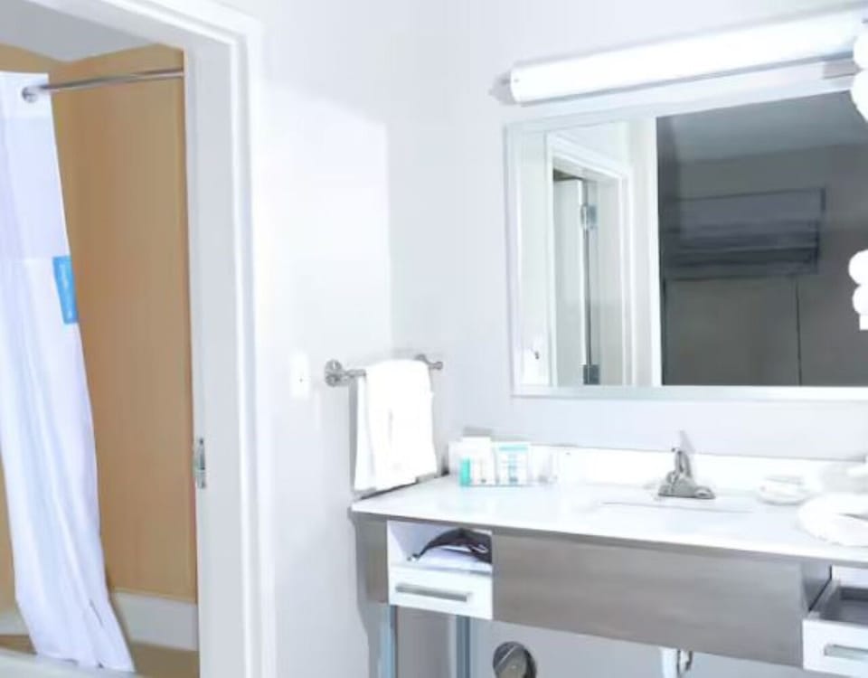 Freshen up with a well-lit vanity and clean towels.