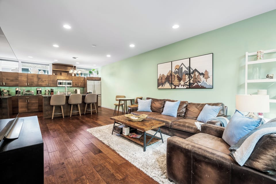Modern living room, cozy vibes. Easy kitchen access.