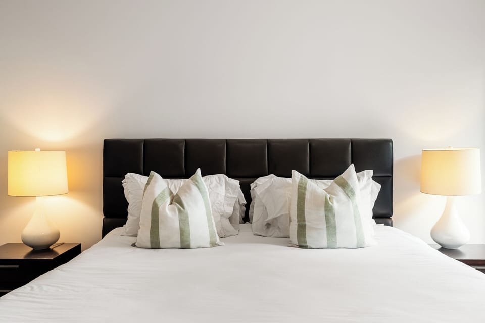 Enjoy a restful night in our spacious master bedroom with a king-size bed! 