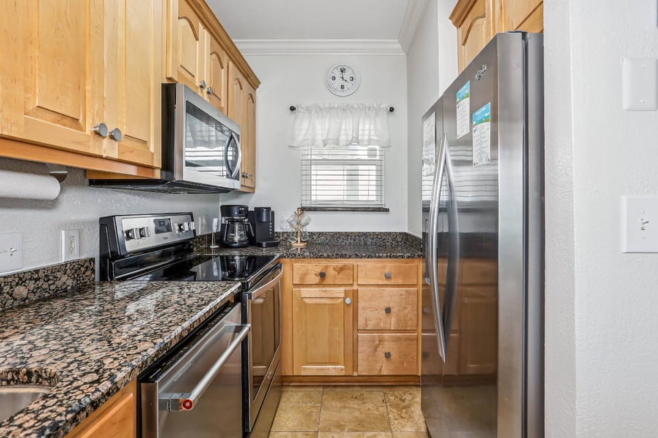 Fully equipped kitchen with stainless appliances and granite counters