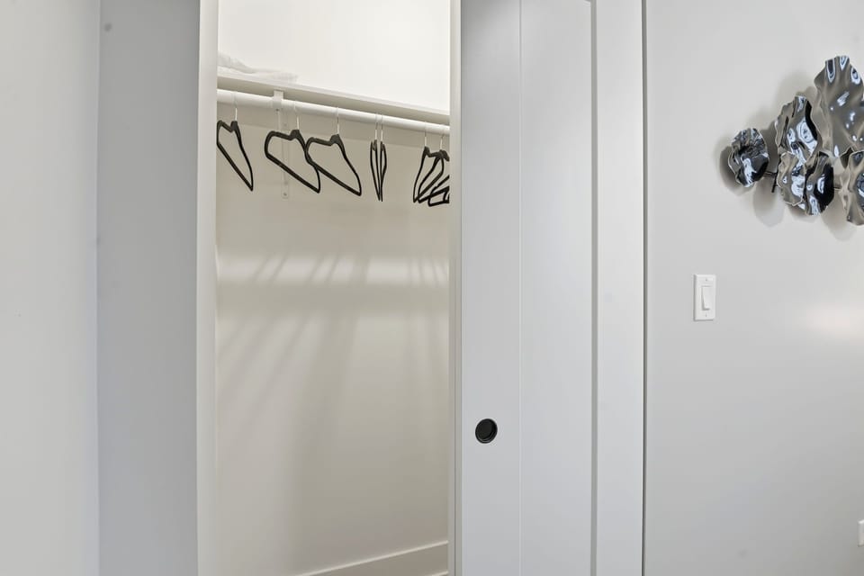 Simple closet area offering space to unpack & settle in