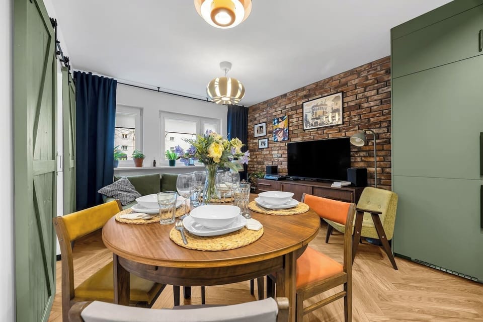 Living Room with Sofa Bed, Smart TV and Dining Table | Book Now with RENTUJEMY