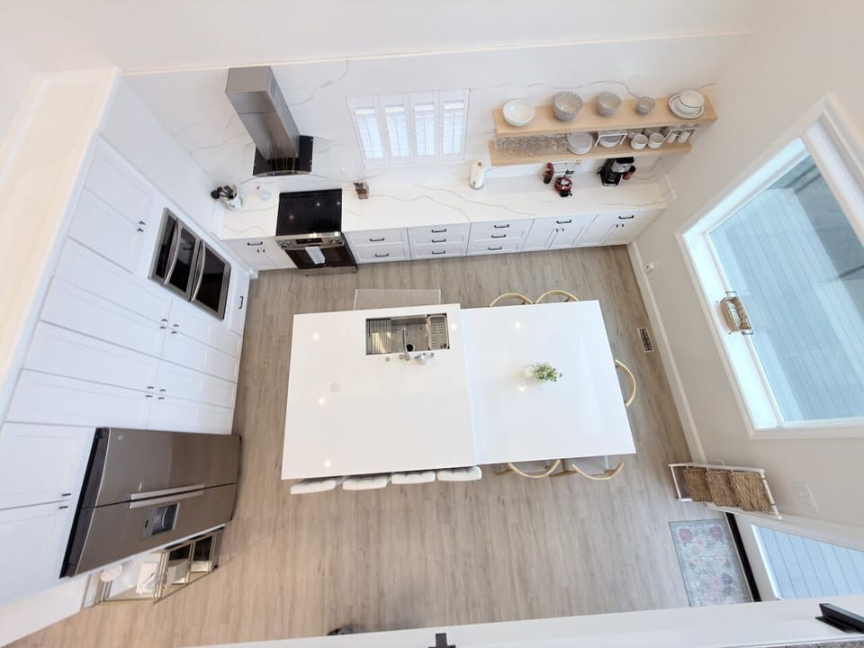 POV from the loft area overlooking the kitchen downstairs.