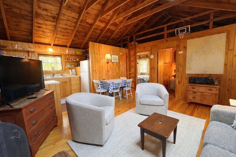 Alternate view of the open living area, dining and kitchen are.