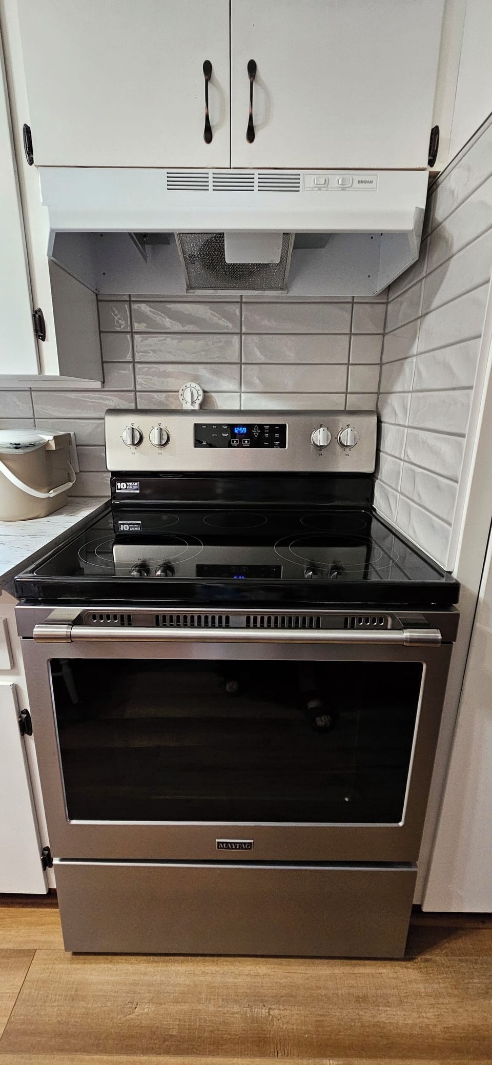 The kitchen also has a brand new stove.