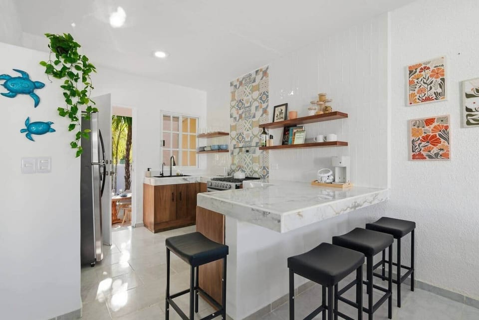 Spacious kitchen island with seating for 4—perfect for preparing meals and enjoying them together.