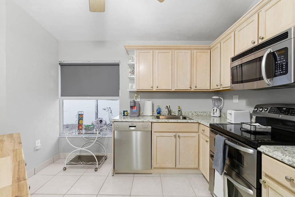 Enjoy this beach stay kitchen with modern appliances, ample counter space, and a bright, functional layout—perfect for preparing meals after a relaxing day at the beach.