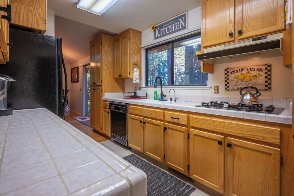 Open kitchen connected to dining and living areas