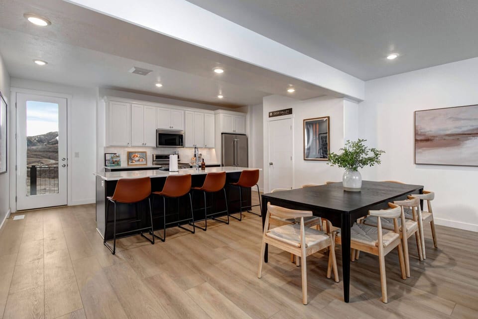 Your modern kitchen flows seamlessly into dining space, perfect for gathering with loved ones over home-cooked meals and morning coffee.