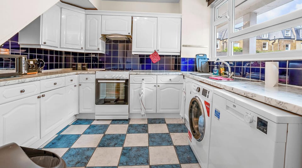 Fully equipped kitchen featuring a microwave, toaster, and kettle. 
