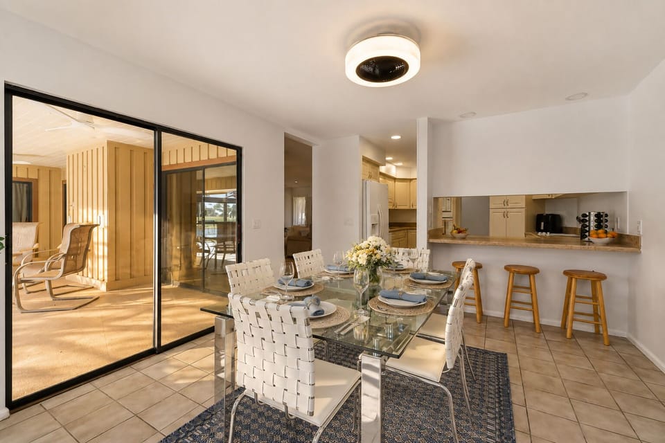 Modern kitchen stocked with quality cookware, and coffee station.