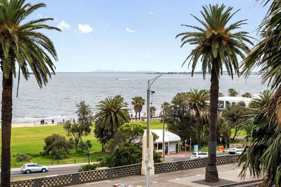 VIEW: The view from the balcony directly looks out over St.Kilda Beach and its iconic palm trees.