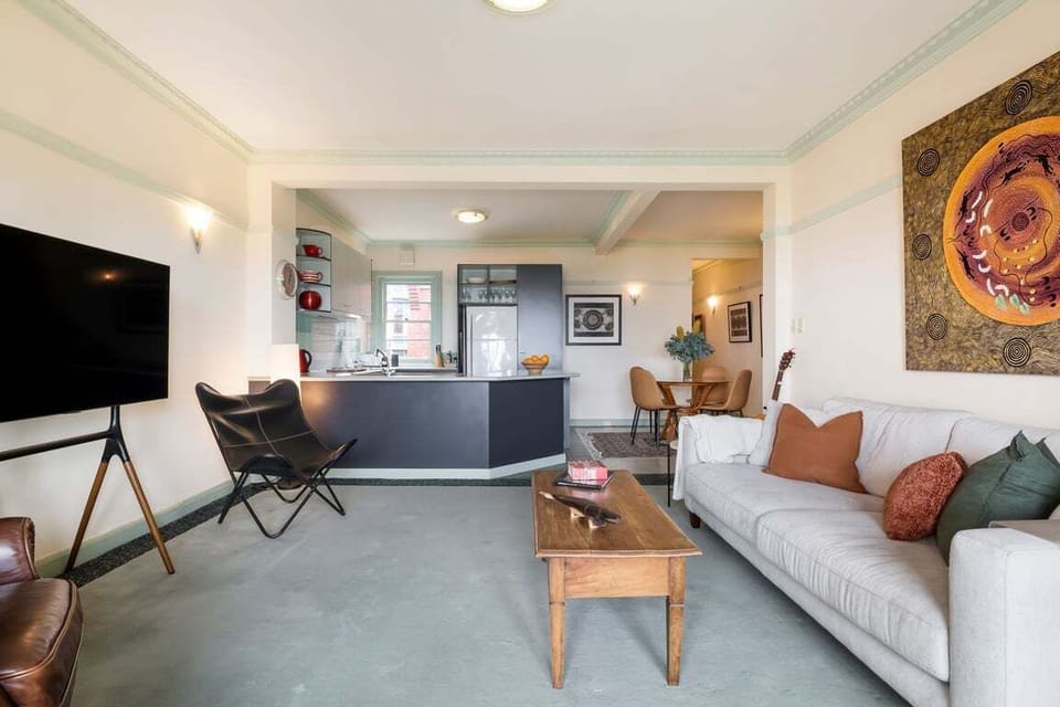 LIVING: Next to the kitchen is the Living Room with a large comfortable couch and large screen Smart TV.