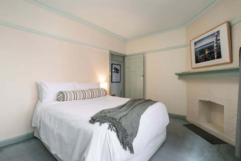 BEDROOM 1: The bedroom has hotel quality linen and a bring outlook.