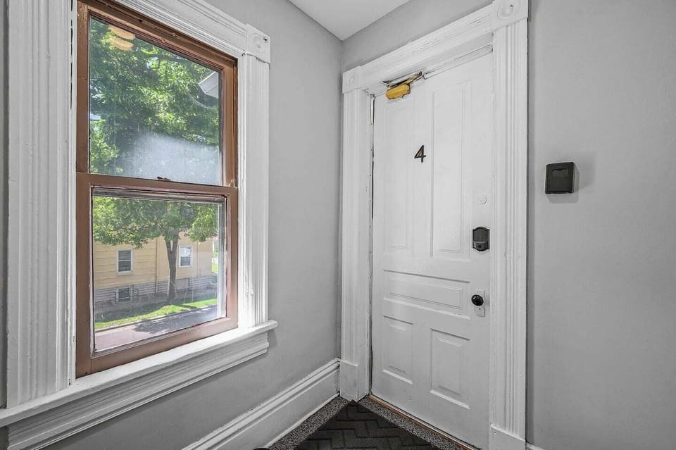 Sunny entryway offers a warm welcome inside.