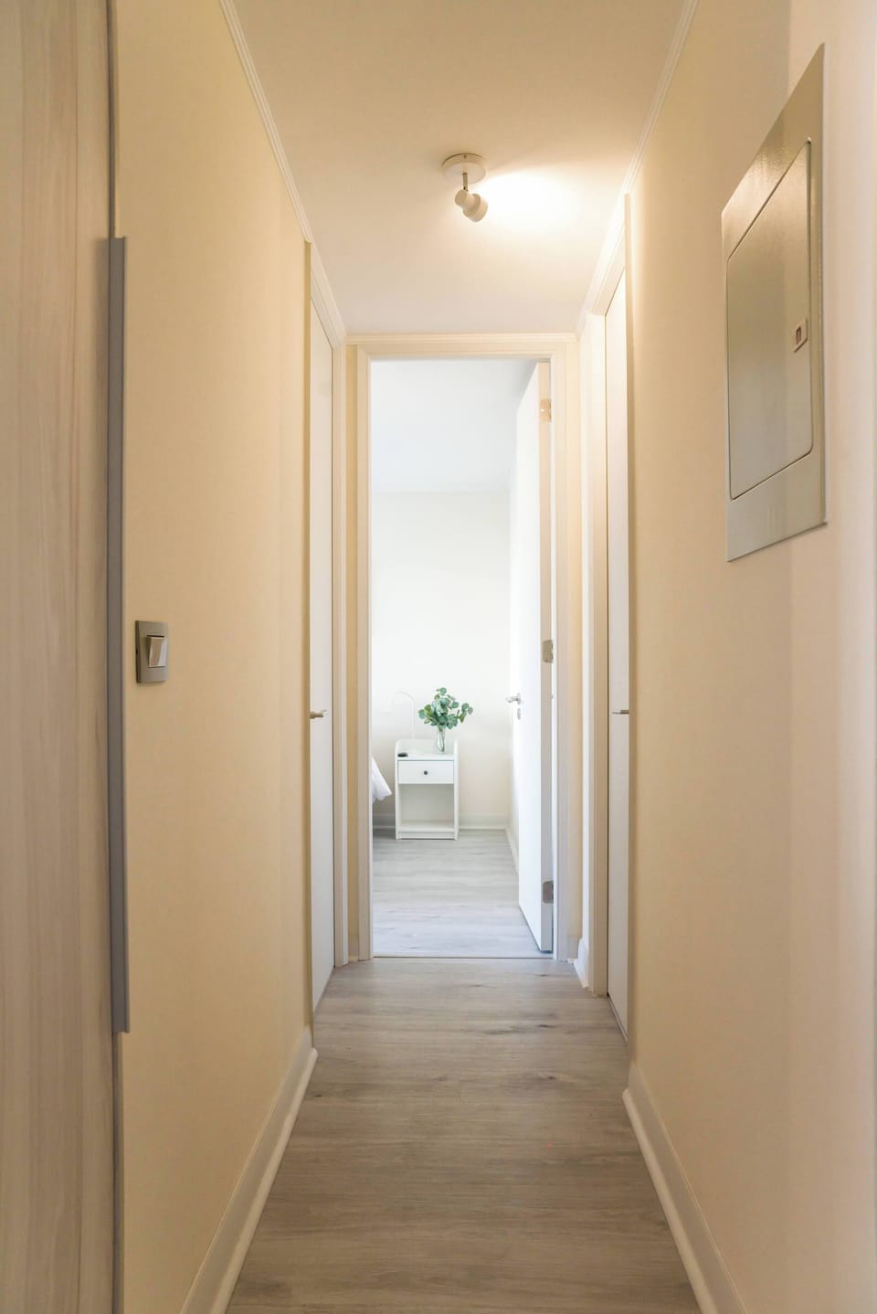 Inviting hallway leading to a serene bedroom, perfect for unwinding after a day of exploration.