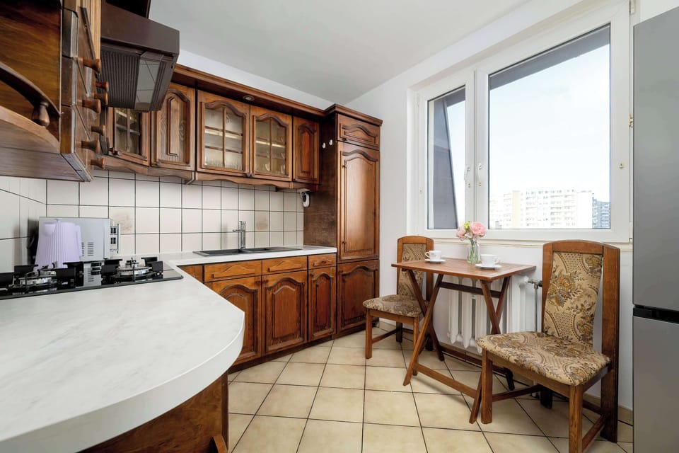 Kitchen with dining table and classic wooden furniture