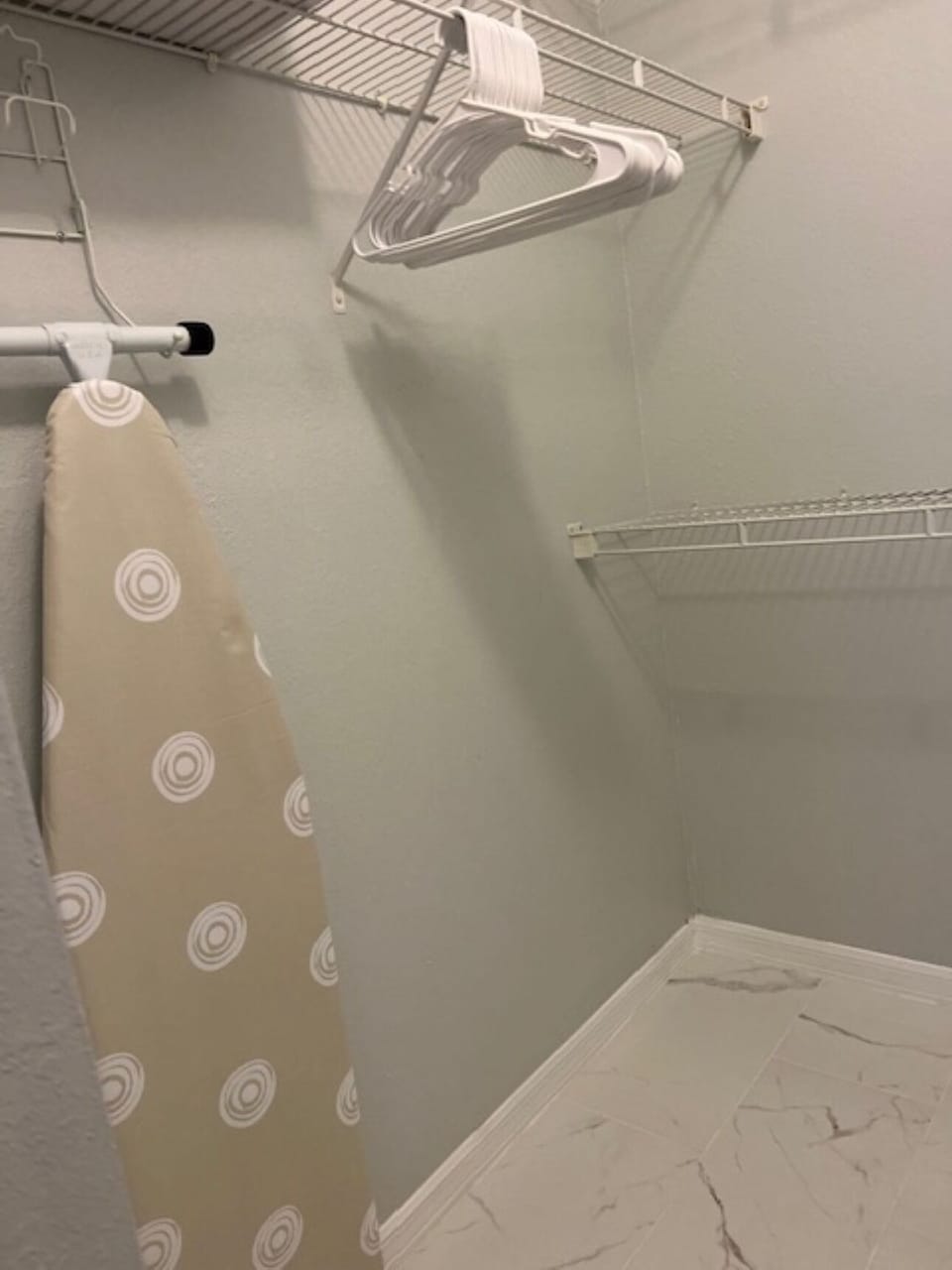 Big closet with Iron and Ironing board plus pack play and baby high chair