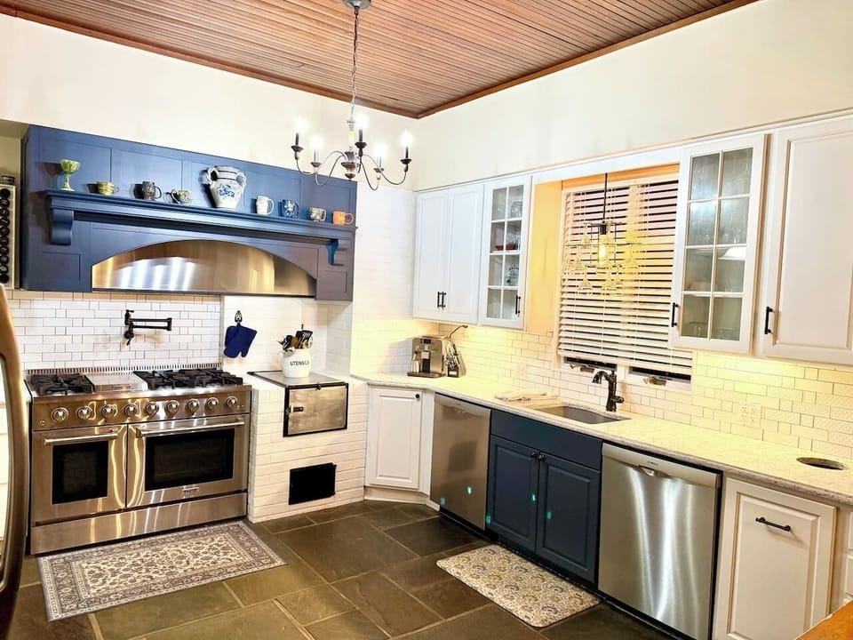 Our kitchen is perfect for preparing large meals for gathering. It features a 6 burner gas stove, a double oven and two dishwashers. 