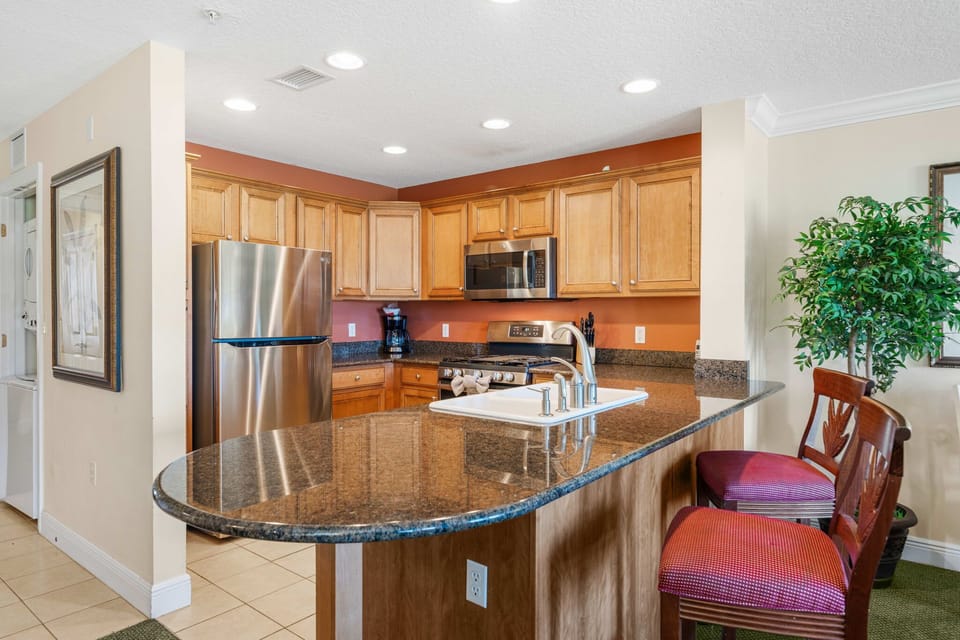 Open-concept floor plan connects the living room, dining area, and kitchen for effortless entertaining.